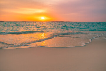 Fototapeta premium Closeup sea sand beach. Panoramic beach landscape. Inspire tropical beach seascape horizon. Colorful golden sunset sky calmness tranquil relaxing sunlight summer vibes. Vacation travel holiday banner