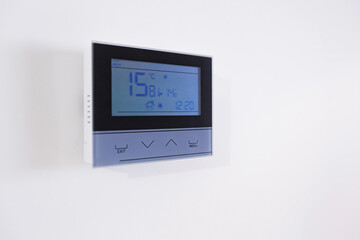 Control panel, air conditioning and heating system of the house, on a white wall, smart home