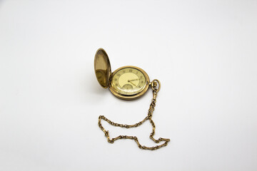 Vintage golden old pocket watch on white background.