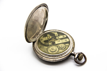 Vintage golden old pocket watch on white background. Old mechanism inside watch