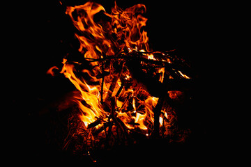 Fototapeta na wymiar A bonfire on a winter night gives a feeling of calm and peace, fire gives warmth.