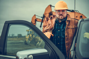 Construction Contractor Worker with Tool Belt on His Shoulder © Tomasz Zajda