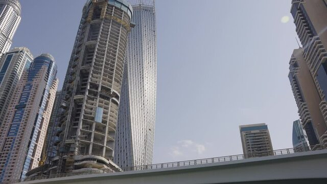 Dubai Marina Entrance Approaching Buildings Close Up Pan Up