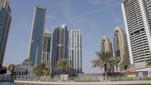 Dubai Marina Palm Trees, Buildings and Mosque Moving Rotating Pan Up