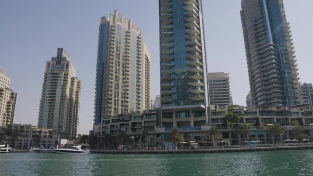 Buildings on Dubai Marina Front Slow Moving Pan Up