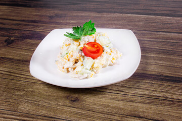 Festive Vitamin Salad with tomato, cucumber, corn, potato and mayonnaise