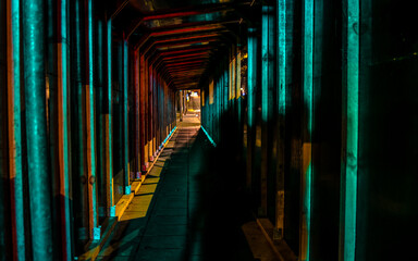 person shadow in a tunnel