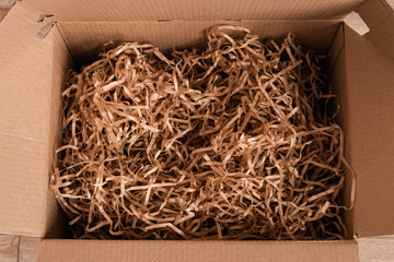 Moving day, box with paper material.Eco material for packaging goods, things, fragile items....