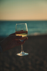 Wine glasses at sunset on the beach. Selective focus.