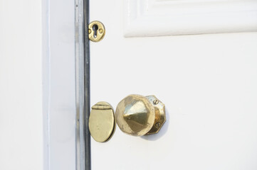 Brass door handle and key hole on victorian door