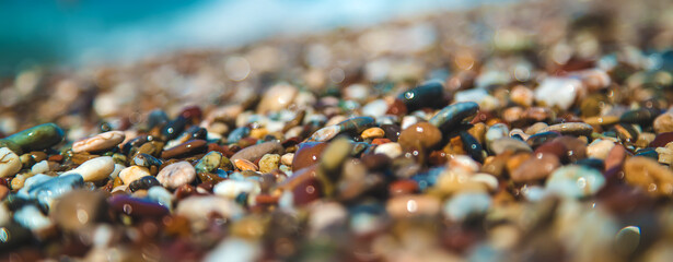 Pebbles on the beach by the sea. Selective focus.
