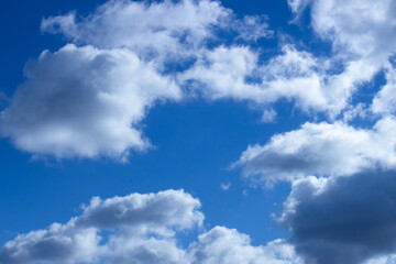 Naklejka na ściany i meble Blurry white clouds and blue sky for background