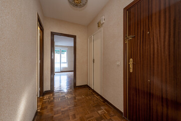 Hallway of a residential home with vintage parquet floors