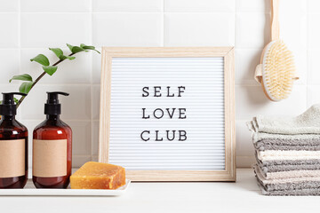 Bathroom styling and organization. Letter board with text Self Love Club. Organic lifestyle and...