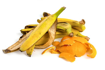 Fruit waste, banana peel and citrus isolated on white background © malshak_off