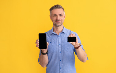 customer use online money on mobile phone. show business name card.