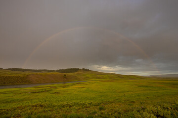 Full Rainbow Over Hayden Valley On Rainy Day