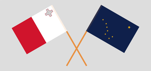 Crossed flags of Malta and the State of Alaska. Official colors. Correct proportion