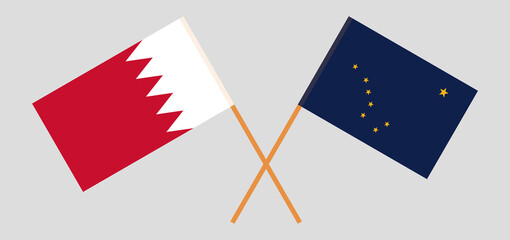 Crossed flags of Bahrain and the State of Alaska. Official colors. Correct proportion