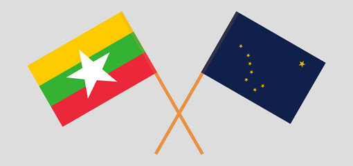 Crossed flags of Myanmar and the State of Alaska. Official colors. Correct proportion