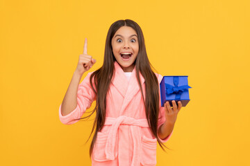 happy teen girl inspired with idea in home terry bathrobe with gift or present box, idea