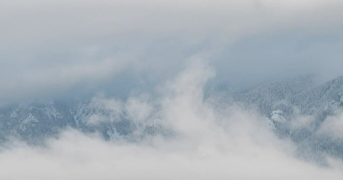 Timelapse video of snowy mountain range during a cloudscape in Vancouver, Canada