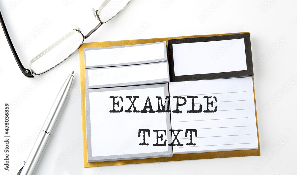 Poster example text text on sticky notes with glasses and pen, business concept