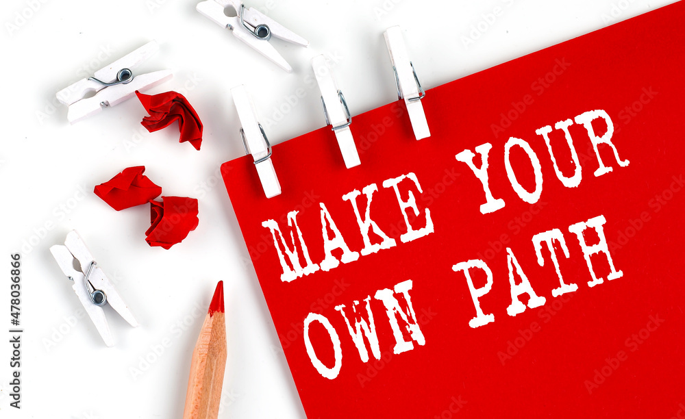 Aufkleber make your own path text on red paper with office tools on the white background