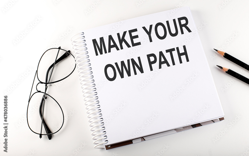Aufkleber notepad with text make your own path white background. business concept