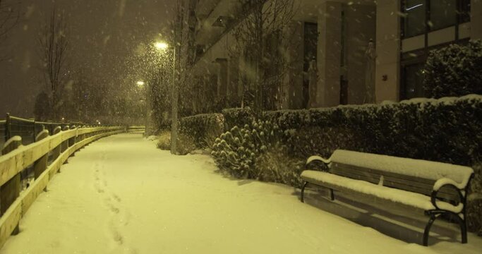 4K Stock footage of a snowfall blizzard in Vancouver's cityscape at night