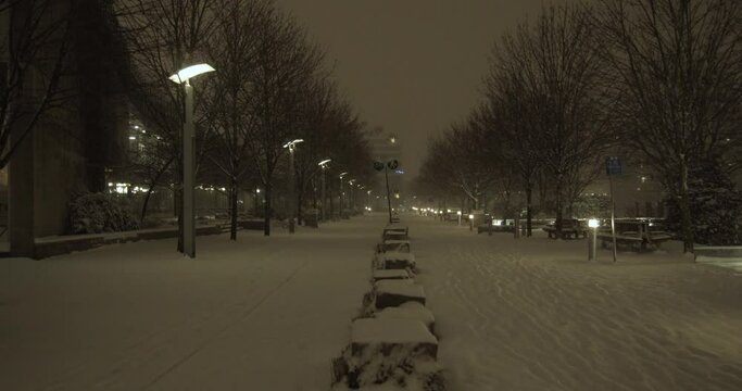 4K Stock footage of a snowfall blizzard in Vancouver's cityscape at night