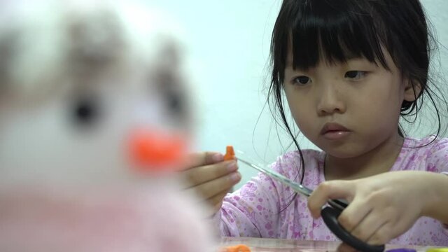 A little girl separate education ABC block. Preschool activity