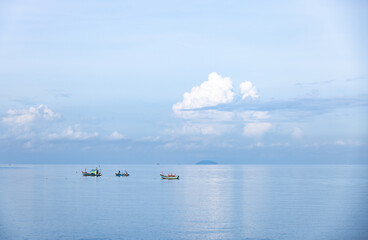 Fototapeta na wymiar panorama fishing boats in the calm blue sea. Concept of natural and Thailand view.