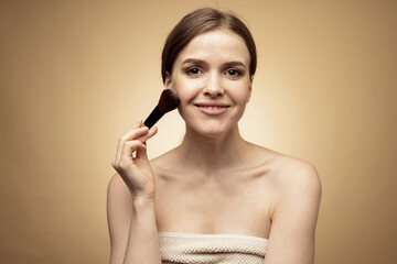 Portrait of a beauty woman with clean skin, doing makeup on her face.