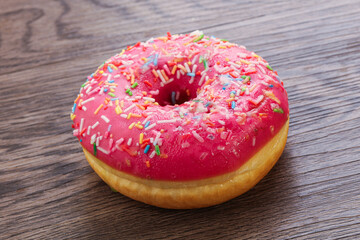 Sweet glazed struwberry donut with icing