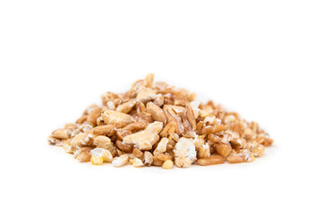 Flaked grains in a pile, close up. Macro of flaked and unsoaked mixed cereal grains, made with a...