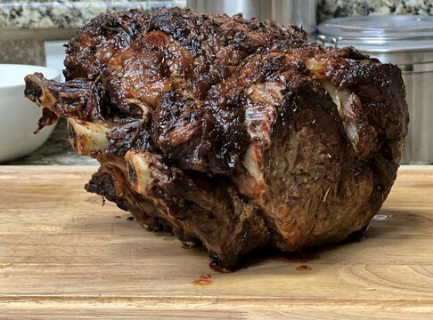 Prime rib on a cutting board for christmas dinner