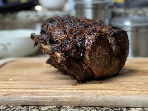 Prime rib on a cutting board for christmas dinner