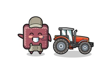 the leather wallet farmer mascot standing beside a tractor