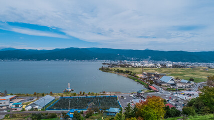 Drone shot of Lake Suwa & Kiso Mountains. Nagano Japan