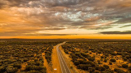 Fototapeta na wymiar Drone Shot of the Sun setting on Goldfields Highway South Australia