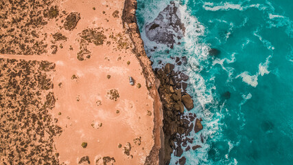 Fototapeta na wymiar Drone shot of an SUV Eucla/Nullarbor National Park Great Australian Bight Coastline South Australia