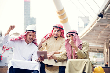 Arab team hold digital tablet uae union teamwork people. Digital marketing arab group of people...