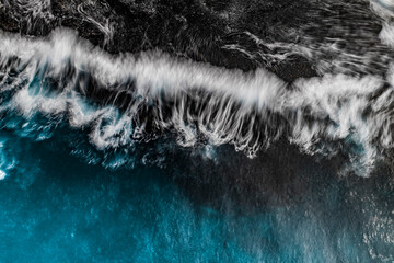 Stylized Long Exposure Drone Shot of Shelly Headland Waves
