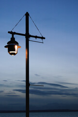 lamp on a pole at dusk