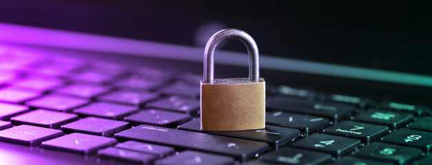 Cybersecurity concept, padlock on laptop computer keyboard - obrazy, fototapety, plakaty
