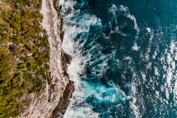 Stylized Long Exposure Drone Shot of Shelly Headland Waves