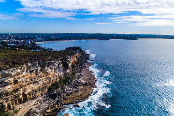 Stylized Long Exposure Drone Shot of Shelly Headland Waves