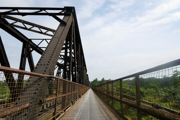 Pathway beside railway track bridge for motorcycle and pedestrian in Manek Urai, Kelantan, Malaysia