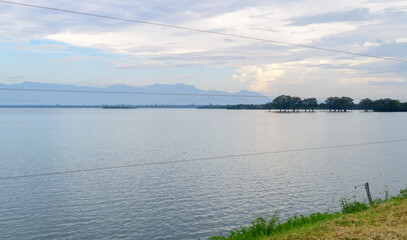 Amazing landscape scenery in Udawalawa national reservoir, Mountain range, and the tree line in the distance.